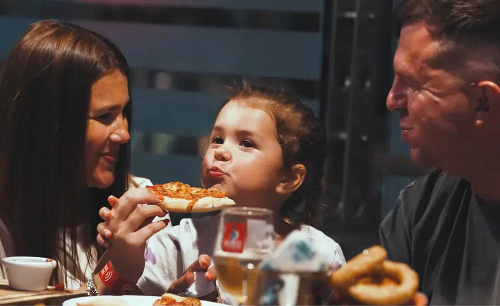 A family sharing pizza
