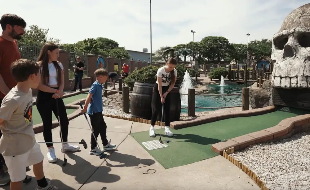A family playing adventure golf
