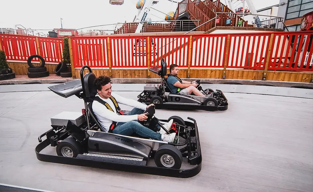 Two go-karts on the 3-level track