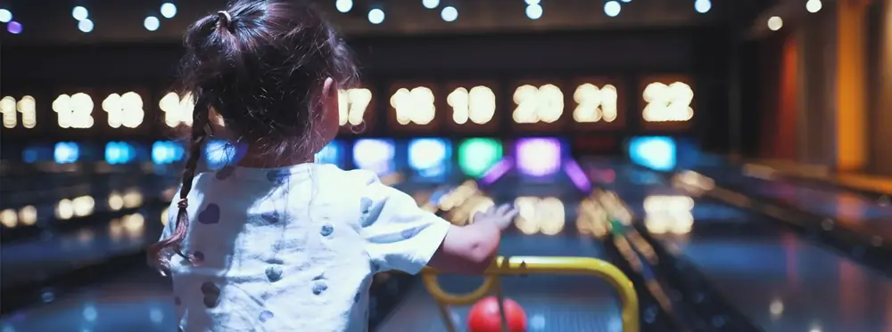 A child bowling at a party
