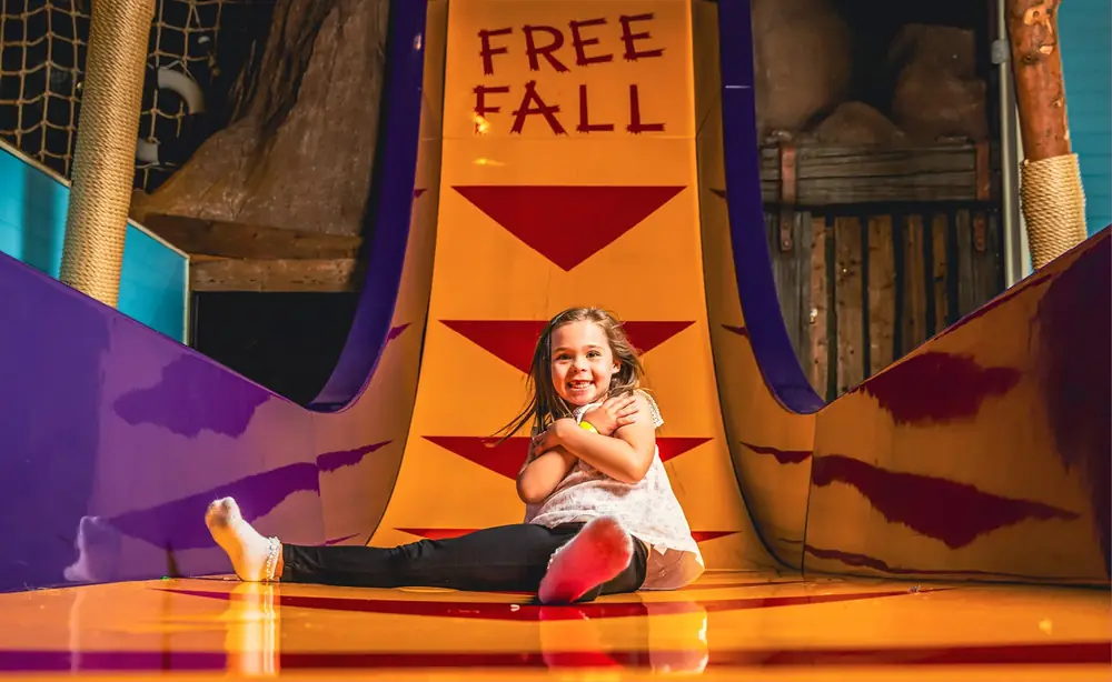 A child on the big slide at Smugglers Cove